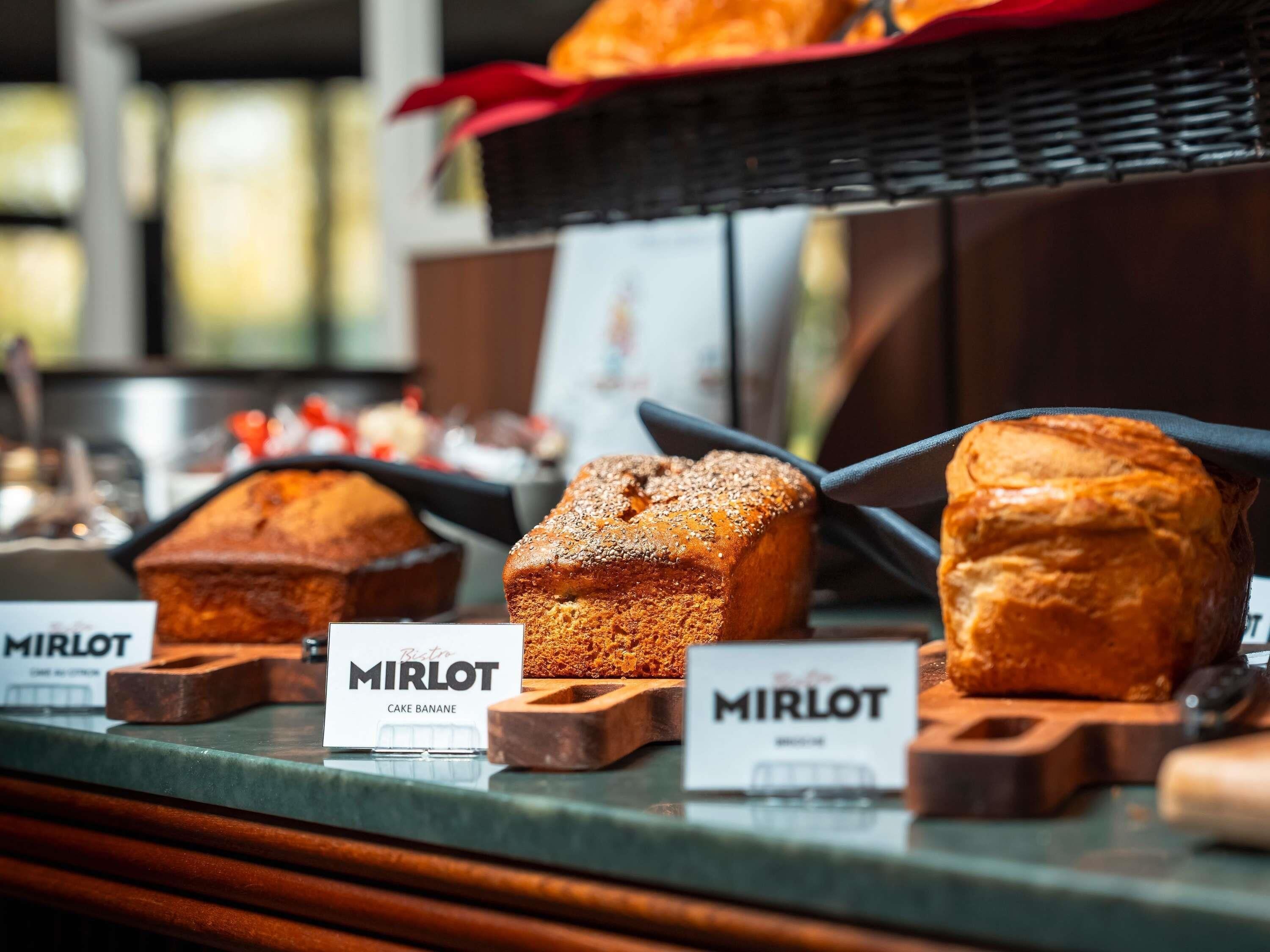 A display of baked goods with labels indicating they are from 'MIRLOT'.