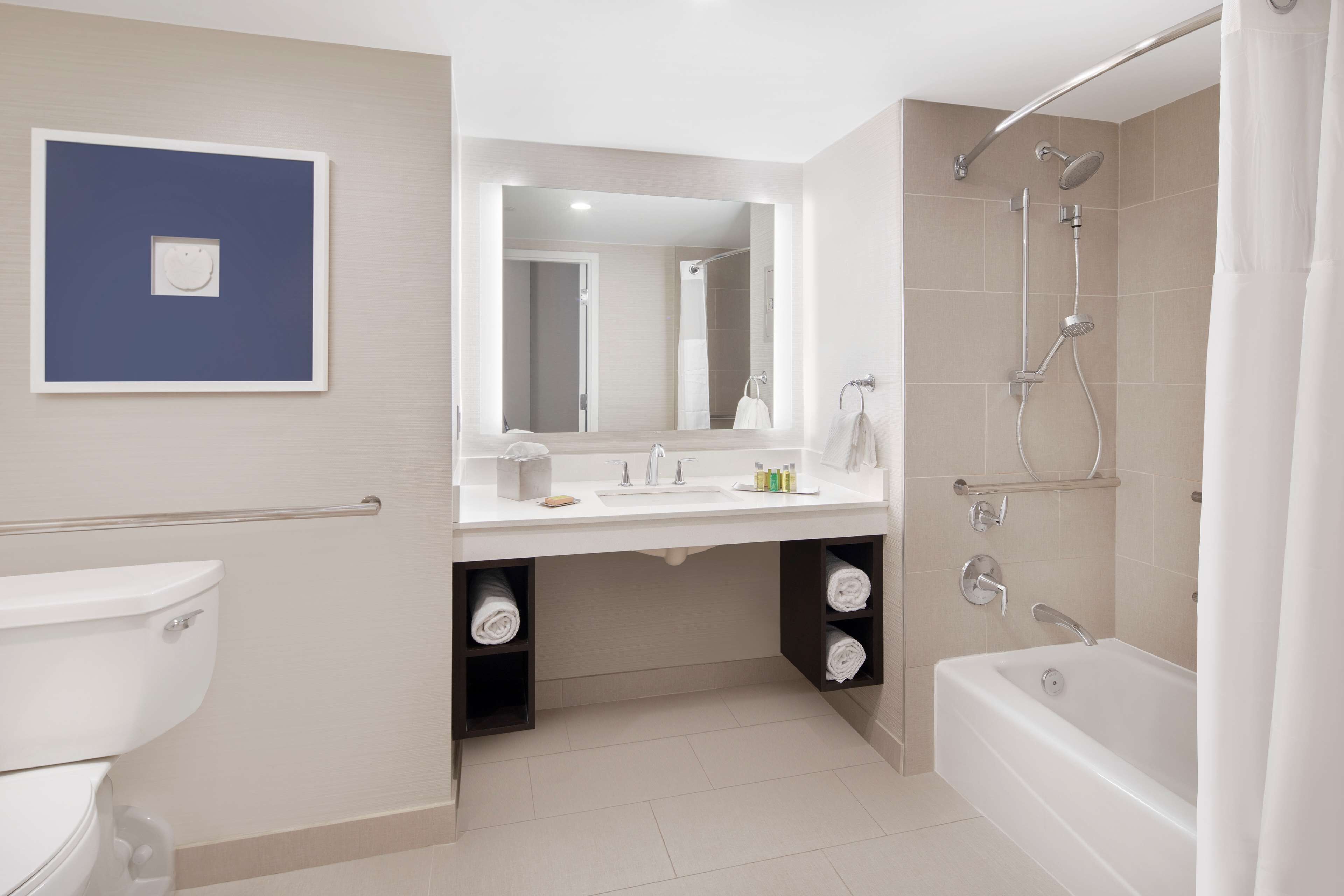 designer toiletries, hair dryer, towels