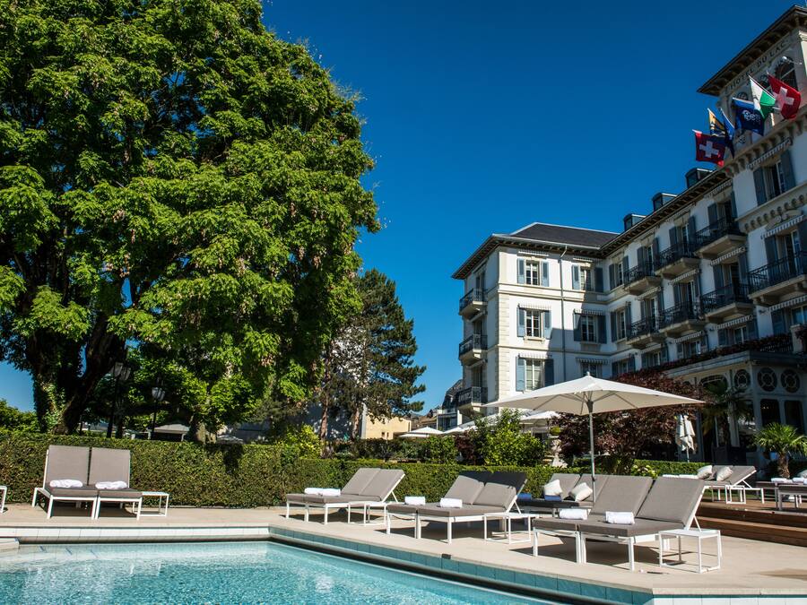 Seasonal outdoor pool, open 9:00 AM to 6:00 PM, pool umbrellas
