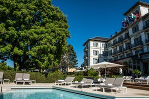 Seasonal outdoor pool, open 9:00 AM to 6:00 PM, pool umbrellas