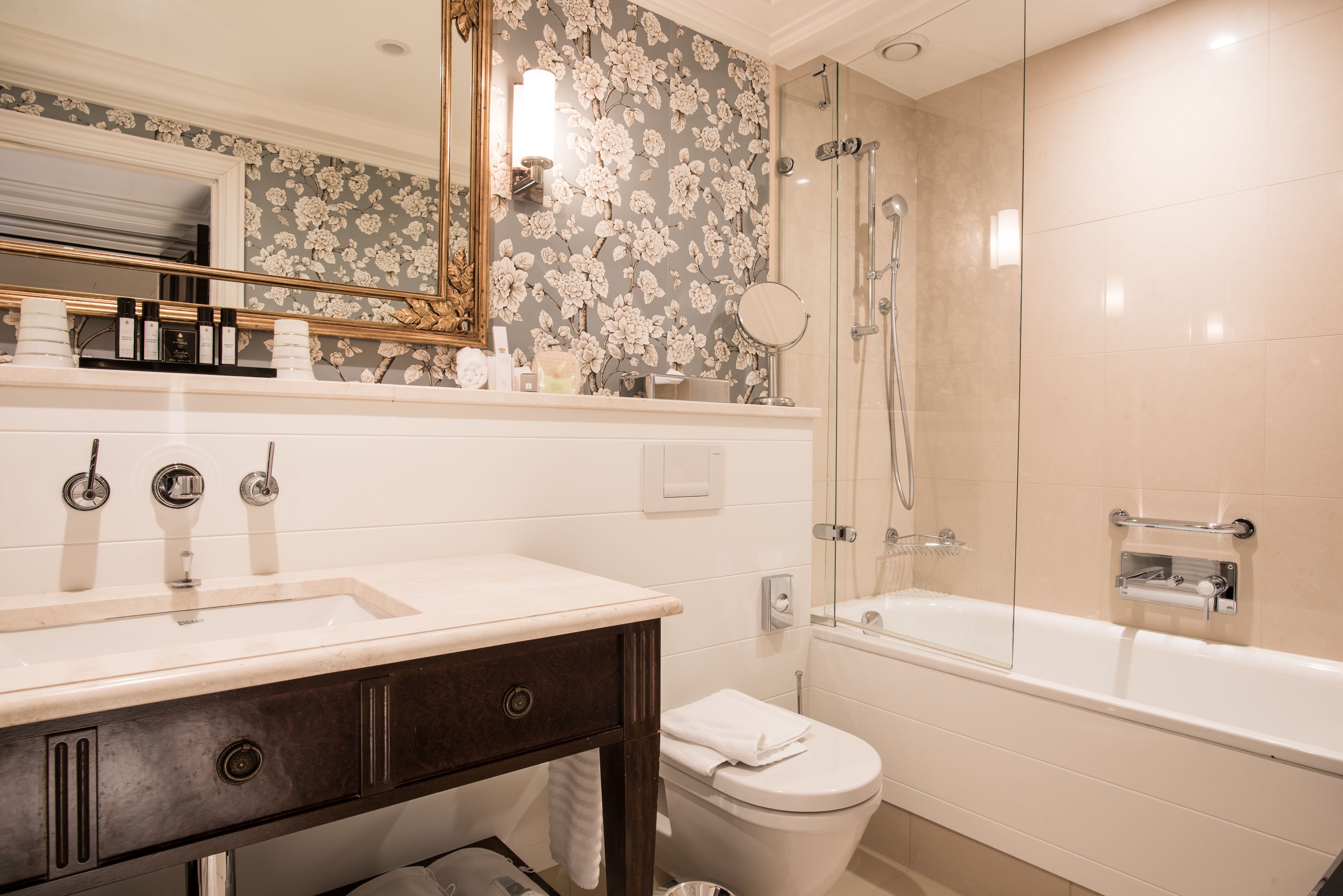 designer toiletries, hair dryer, bathrobes, slippers