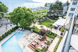 Seasonal outdoor pool, open 9:00 AM to 6:00 PM, pool umbrellas