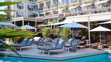 Seasonal outdoor pool, open 9:00 AM to 6:00 PM, pool umbrellas