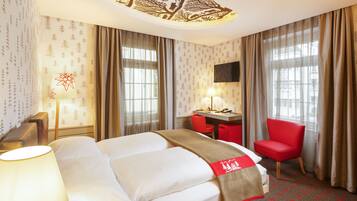 Premium bedding, down comforters, minibar, in-room safe