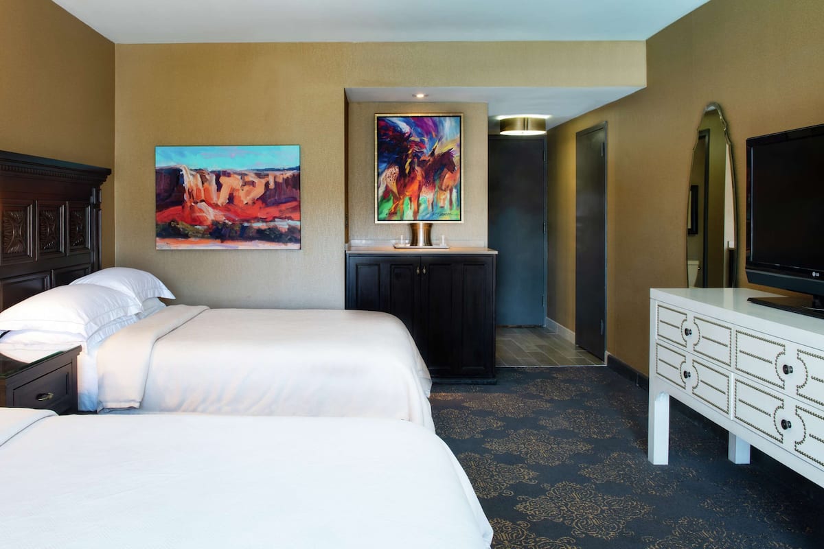 Premium bedding, down duvets, pillow-top beds, in-room safe
