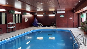 An indoor swimming pool with a wooden interior, a 'No Diving' sign, and a 'No Diving' sign on the poolside. - Econo Lodge Fargo - West Acres (Fargo)