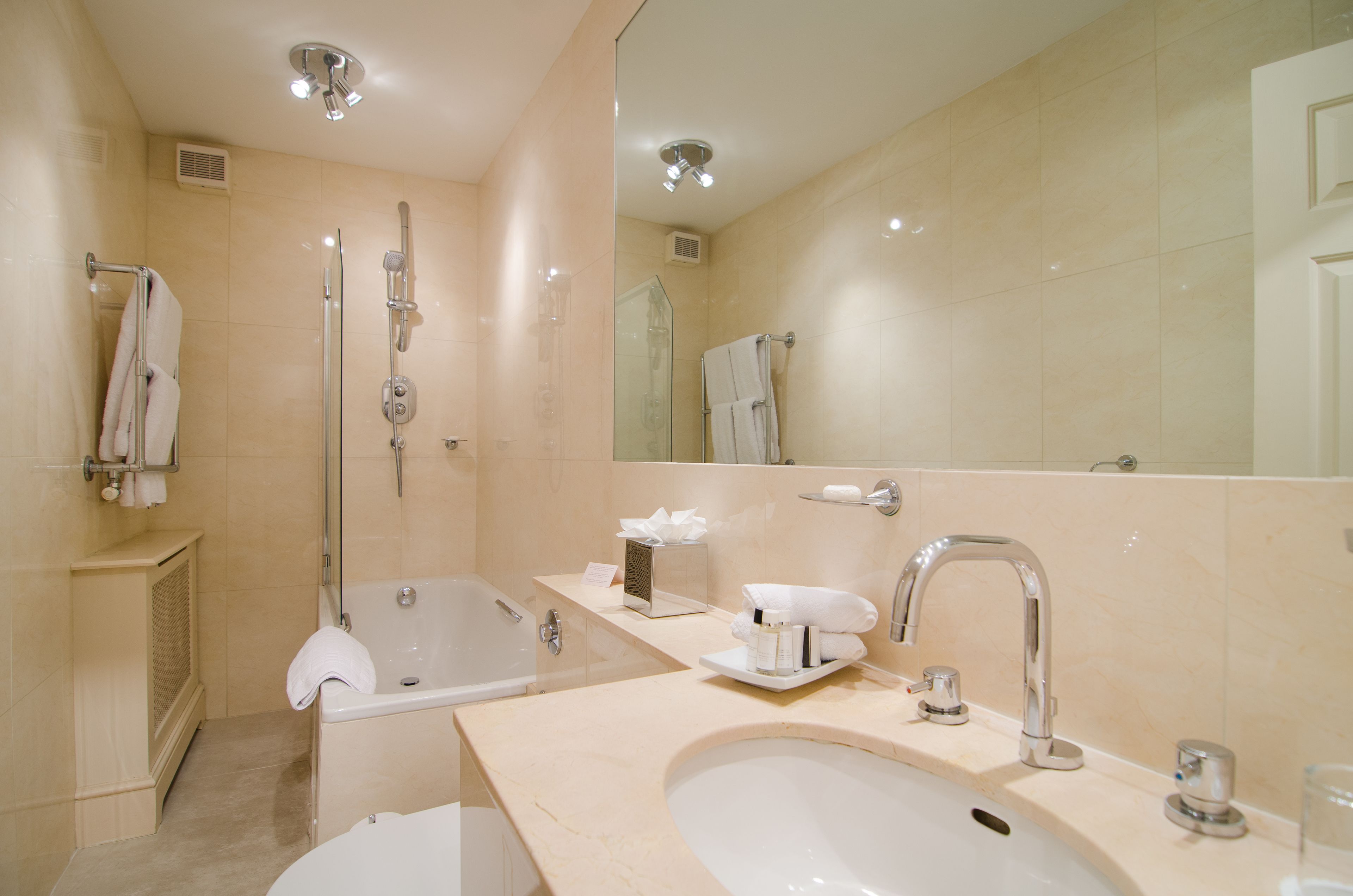 junior suite | bathroom | designer toiletries, hair dryer, bathrobes, slippers