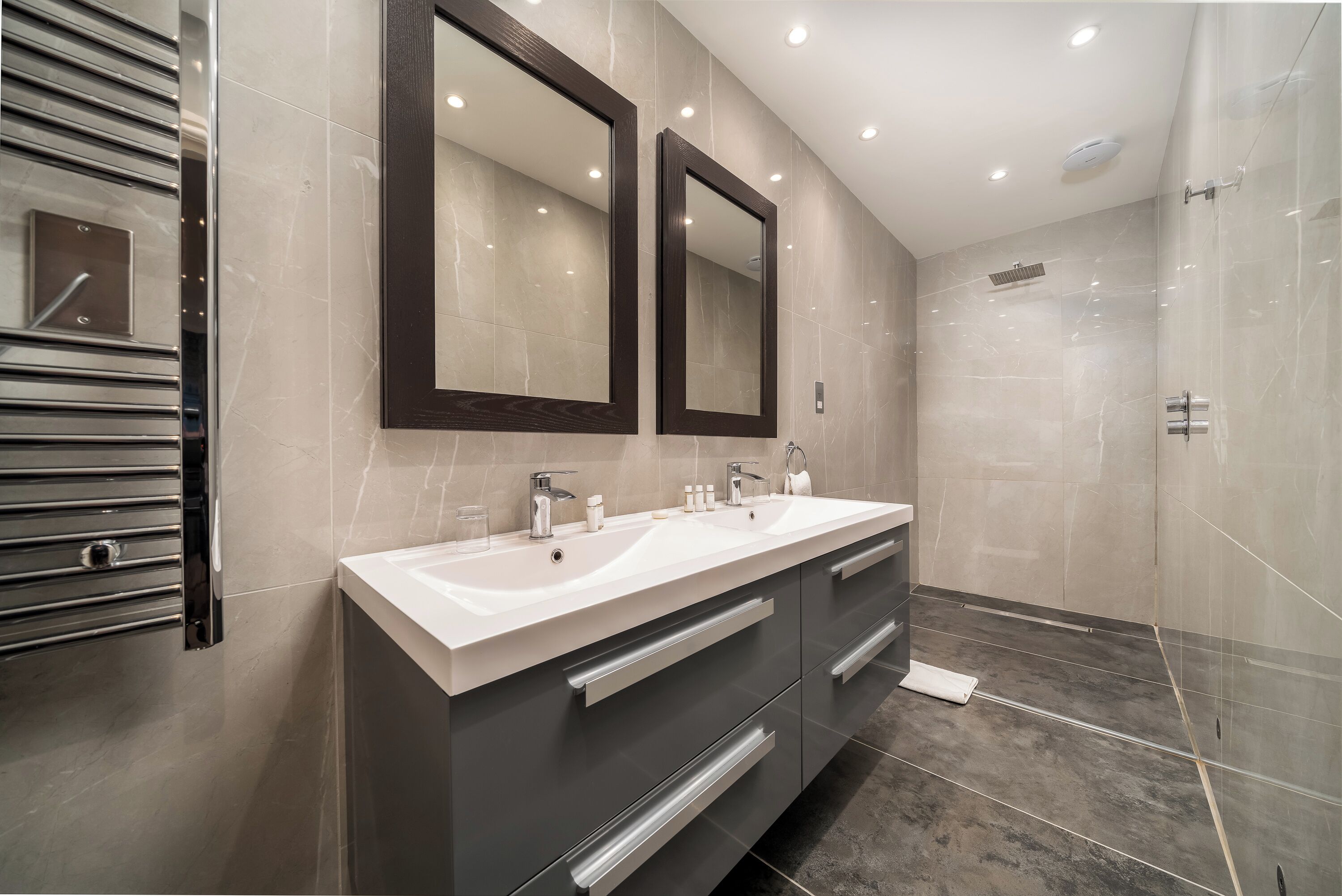 designer toiletries, hair dryer, bathrobes, slippers