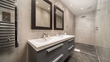 Designer toiletries, hair dryer, bathrobes, slippers