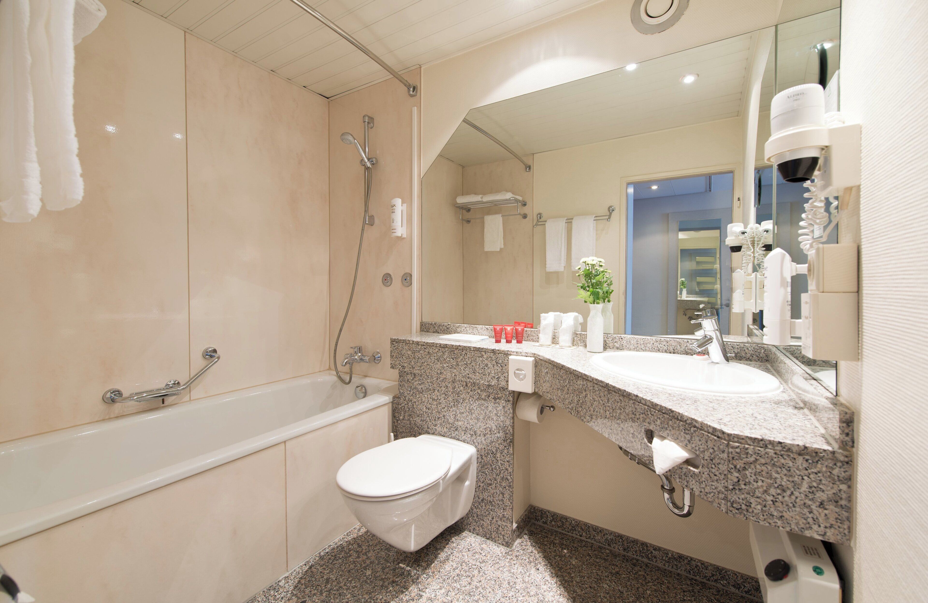 eco-friendly toiletries, hair dryer, towels, soap