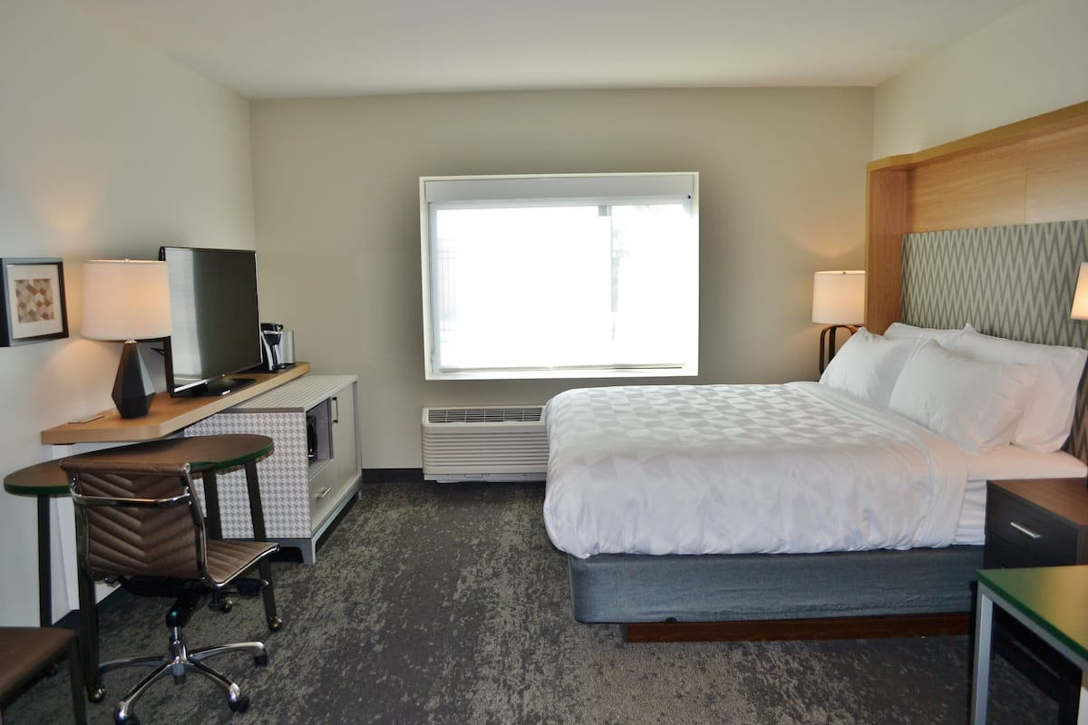 Desk, laptop workspace, blackout drapes, iron/ironing board