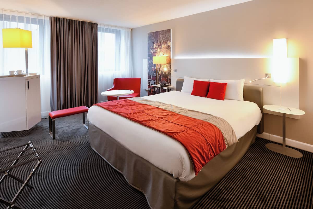 Premium bedding, memory foam beds, in-room safe, laptop workspace