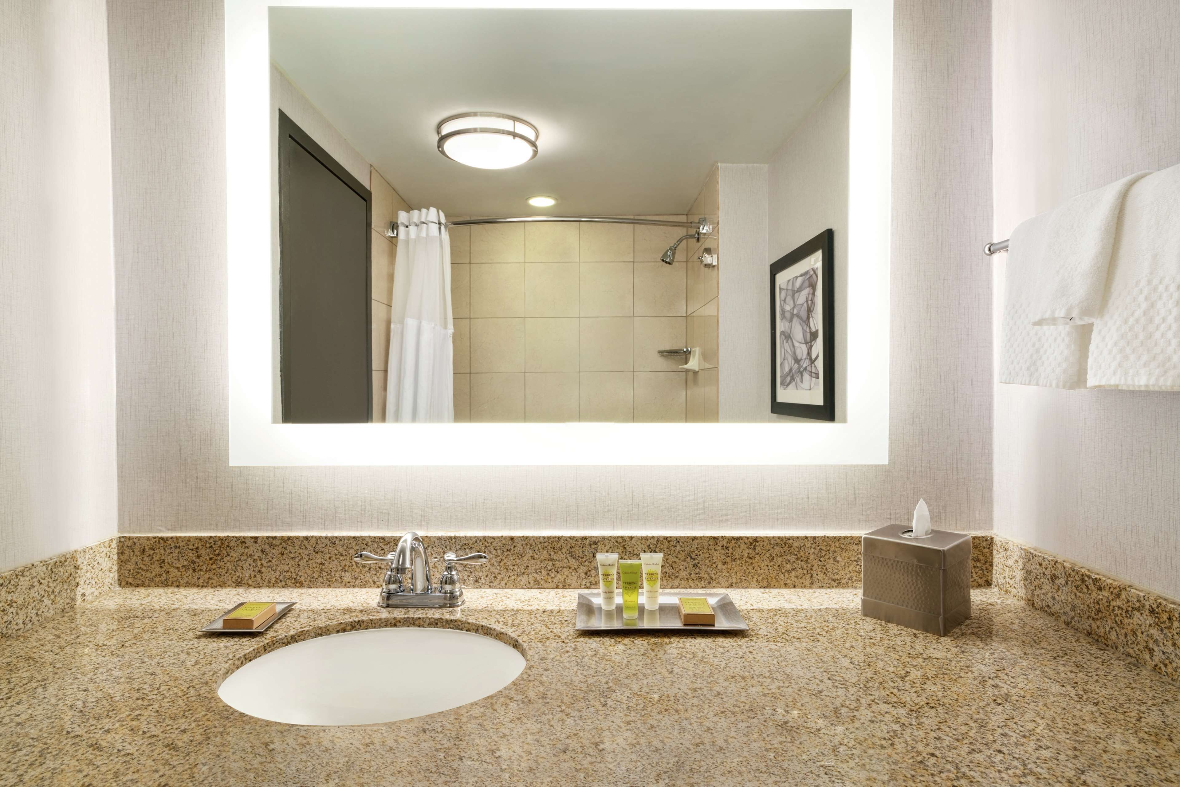 hydromassage showerhead, designer toiletries, hair dryer, towels