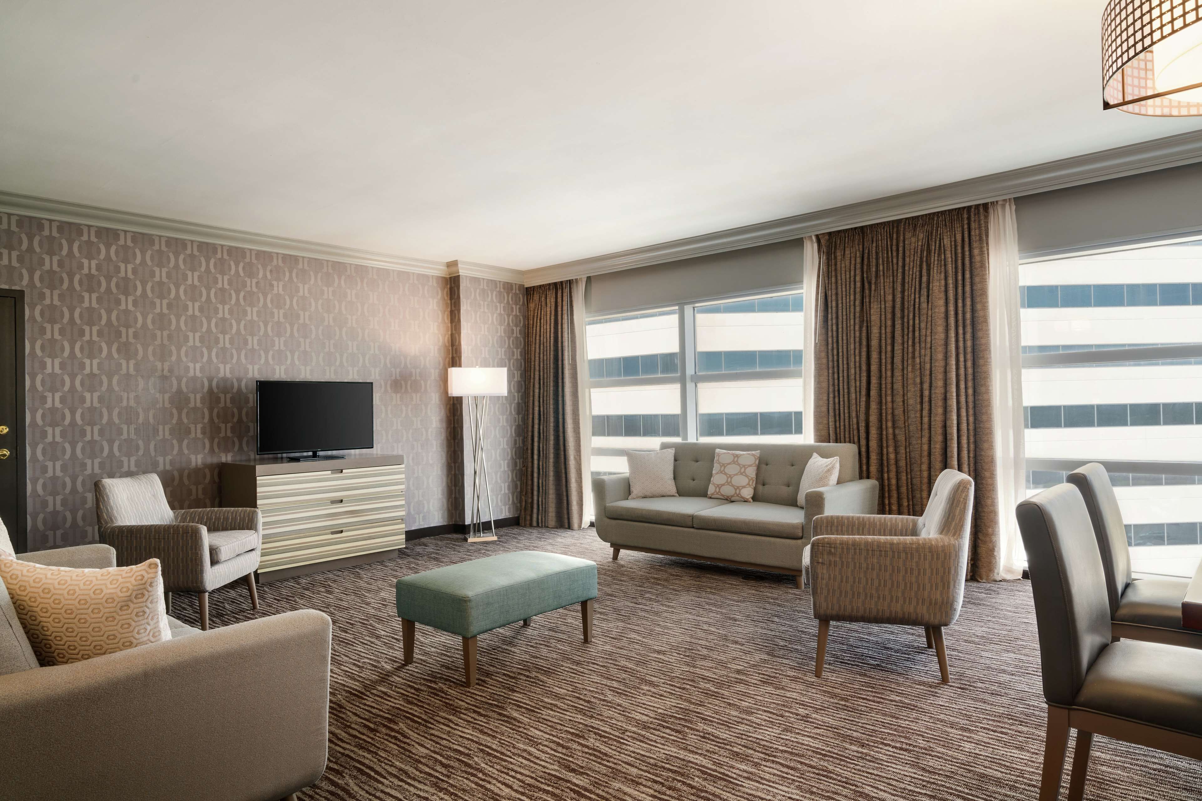 suite, 1 bedroom, balcony | living area | 55-inch tv with digital channels, mp3 dock