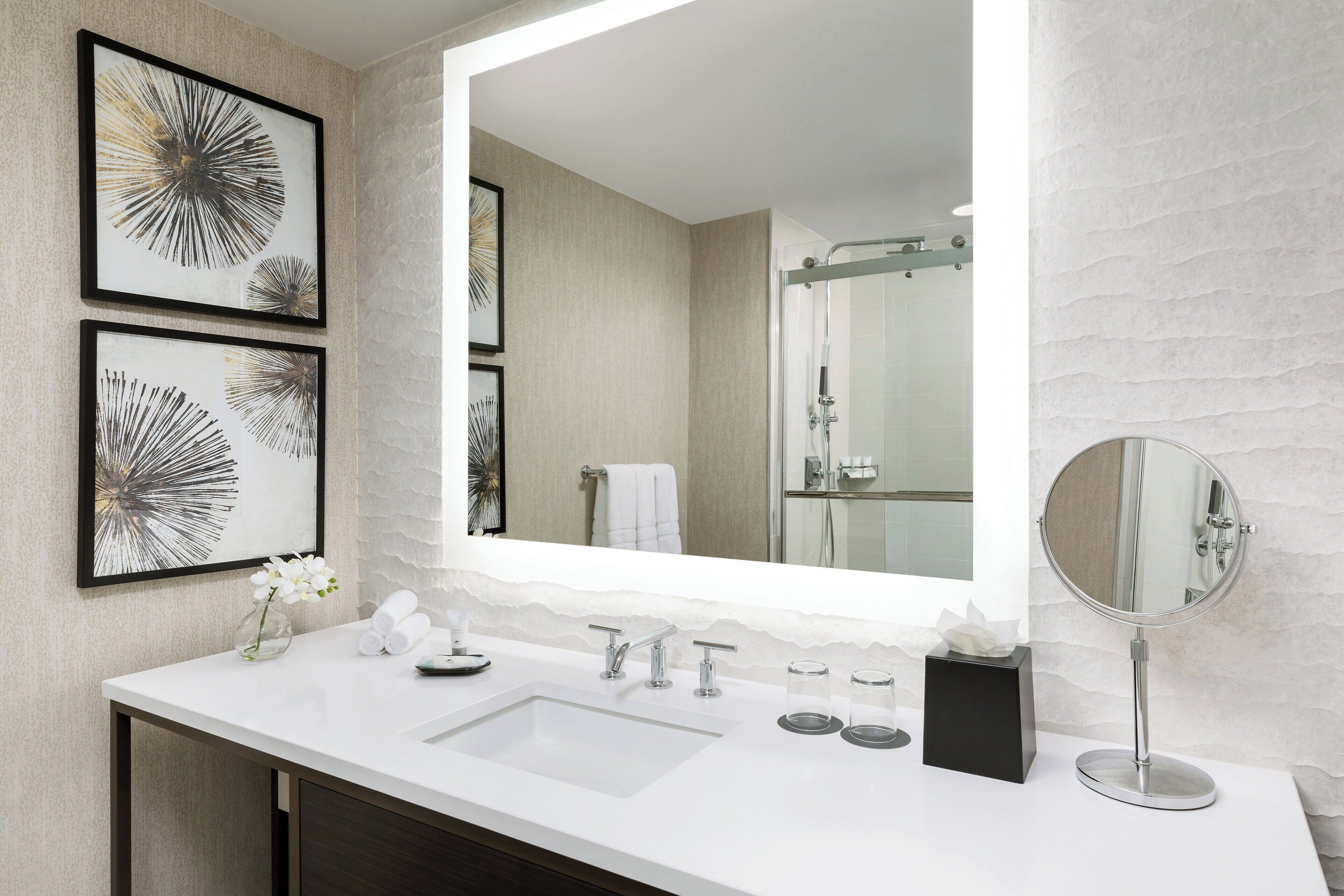 combined shower/bathtub, designer toiletries, hair dryer, bathrobes