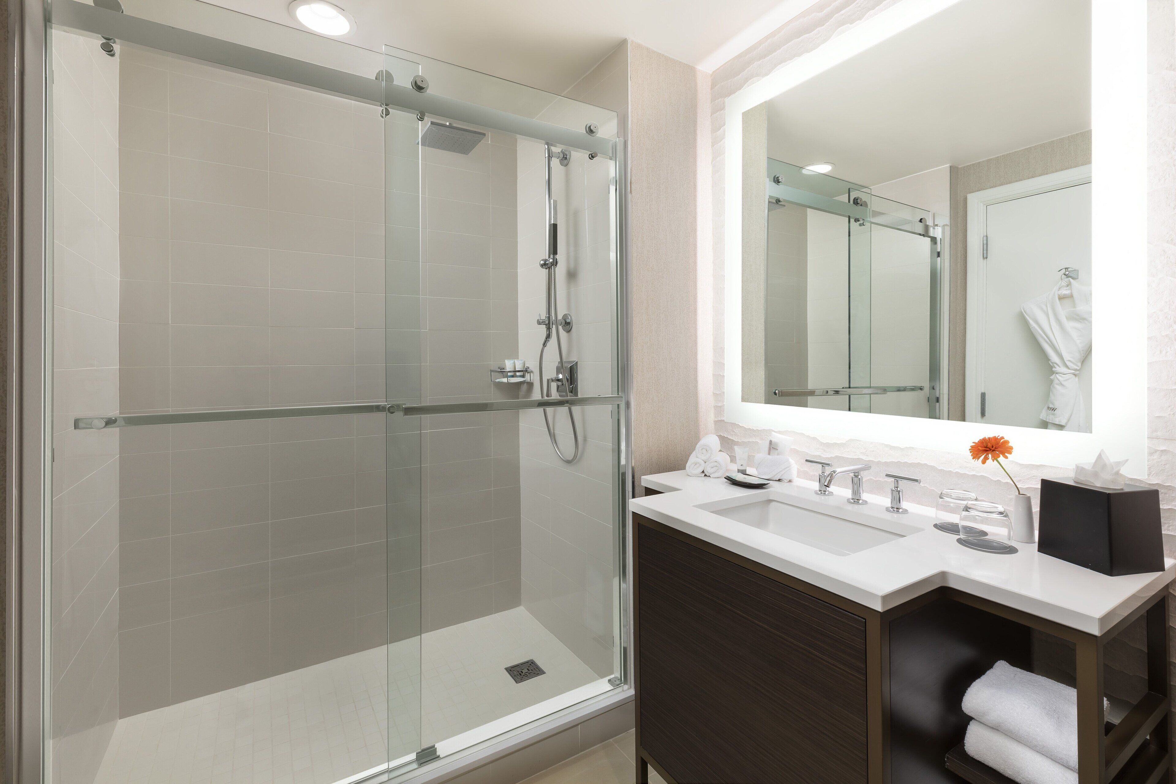 combined shower/bathtub, designer toiletries, hair dryer, bathrobes