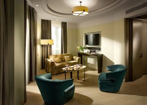 Executive Queen Suite with Wellness Area Access | Living area | 40-inch flat-screen TV with satellite channels, TV