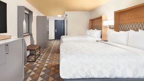 A hotel room with two beds, a desk, a chair, and a television. - Holiday Inn Houston Intercontinental Airport by IHG (Houston)