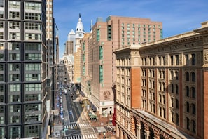 A hotel with a classic architectural style, featuring a prominent facade with detailed stonework and arched windows.