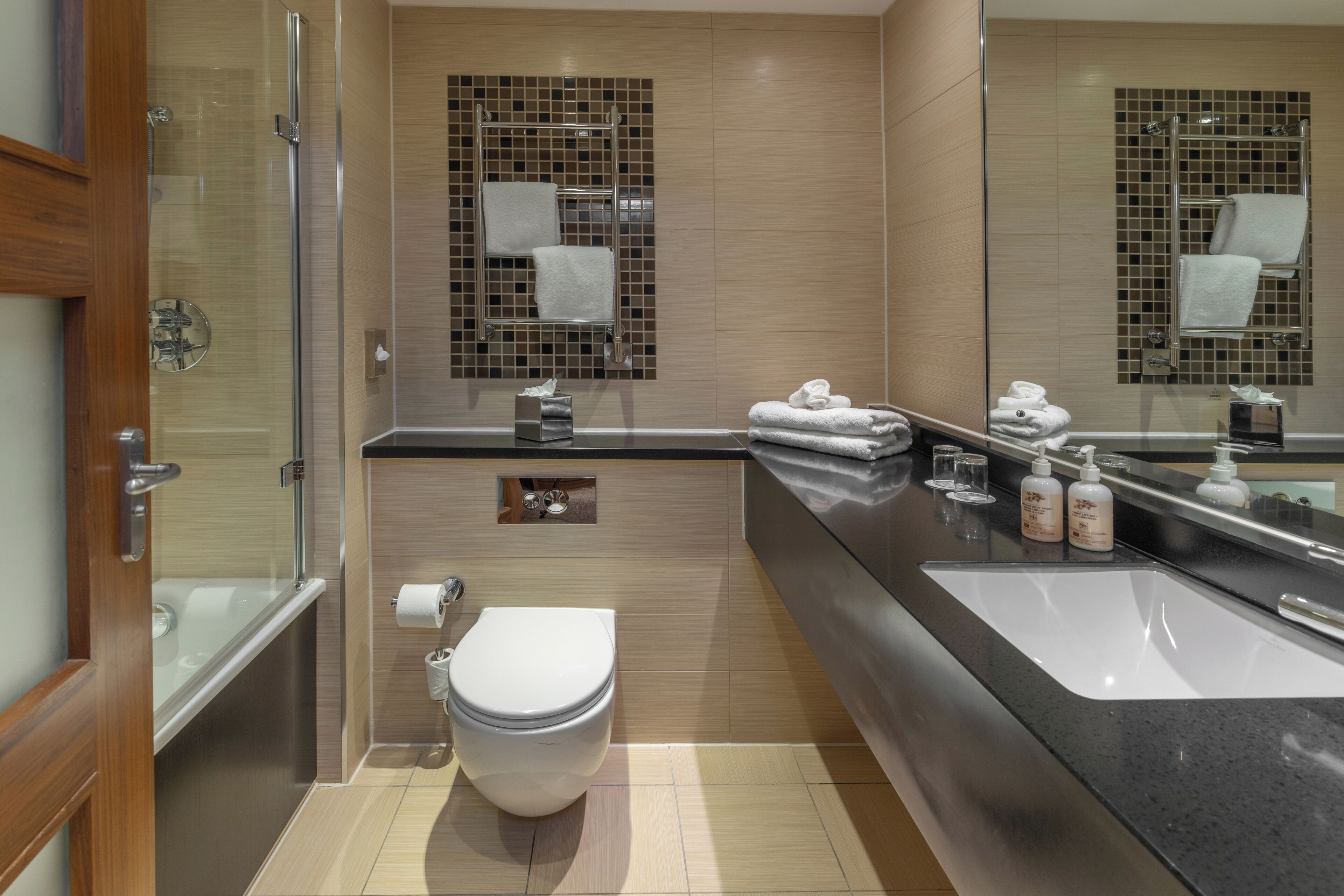 eco-friendly toiletries, hair dryer, towels, soap