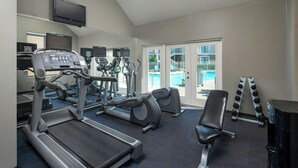 A gym with treadmills, elliptical machines, and free weights. - Residence Inn by Marriott Nashville Airport (Nashville)