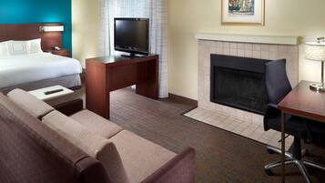 Premium bedding, desk, laptop workspace, blackout drapes