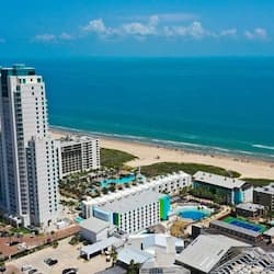On the beach, white sand, beach cabanas, sun loungers
