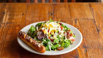 A plate of food on a wooden table.