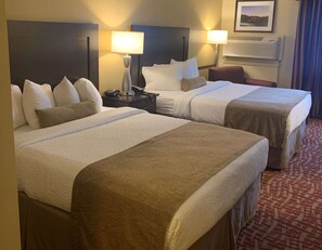 Premium bedding, pillow-top beds, desk, laptop workspace