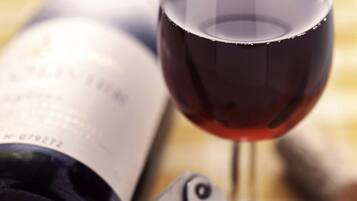 A wine bottle and a wine glass.