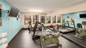 A gym with treadmills, elliptical machines, and exercise balls. - Days Inn by Wyndham Raleigh-Airport-Research Triangle Park (Morrisville)