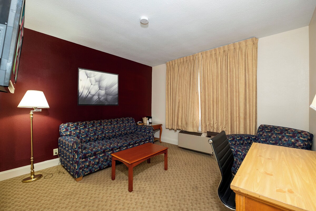 Desk, laptop workspace, blackout curtains, iron/ironing board