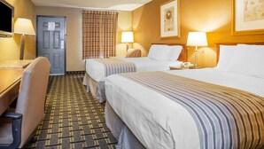 A hotel room with two beds, a desk, a chair, and a television. - Econo Lodge Acworth East (Acworth)