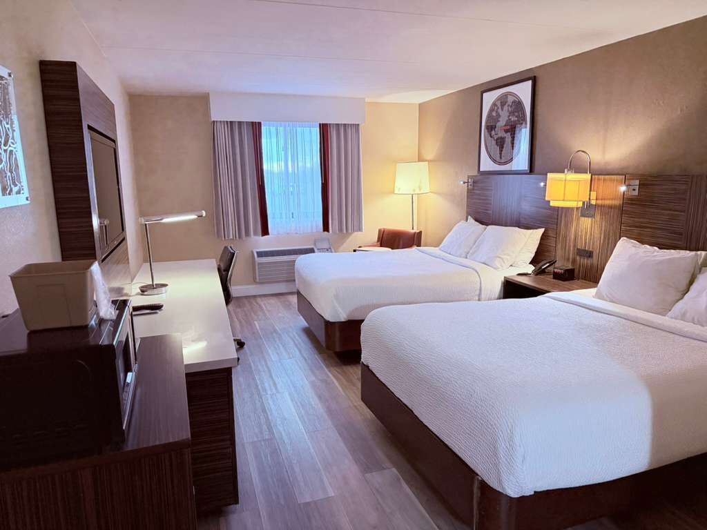 Desk, blackout drapes, iron/ironing board, free cribs/infant beds