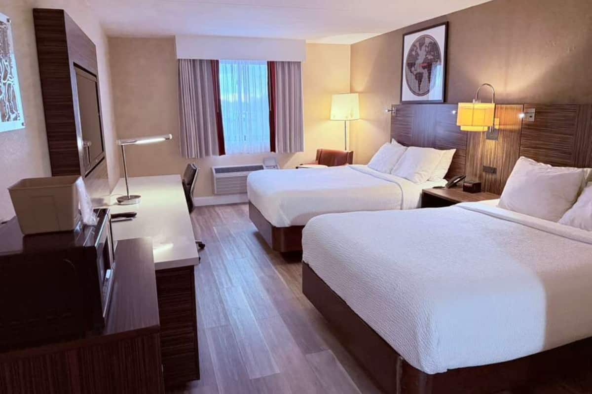 Desk, blackout drapes, iron/ironing board, free cribs/infant beds