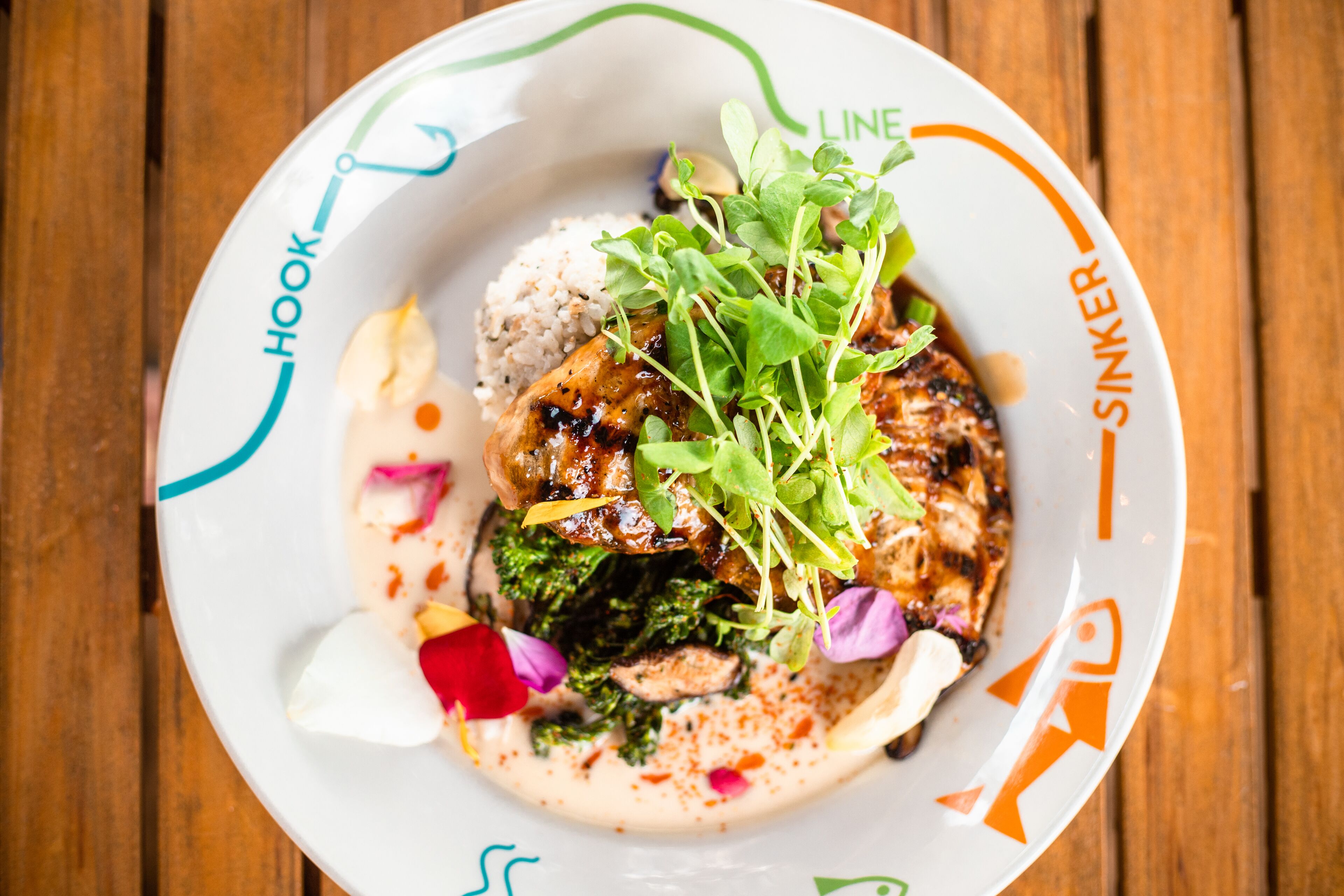 A plate of food with various ingredients and garnishes.