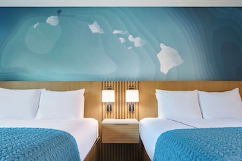 In-room safe, desk, laptop workspace, blackout drapes at Kauai Shores Hotel