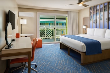 In-room safe, desk, laptop workspace, blackout drapes at Kauai Shores Hotel