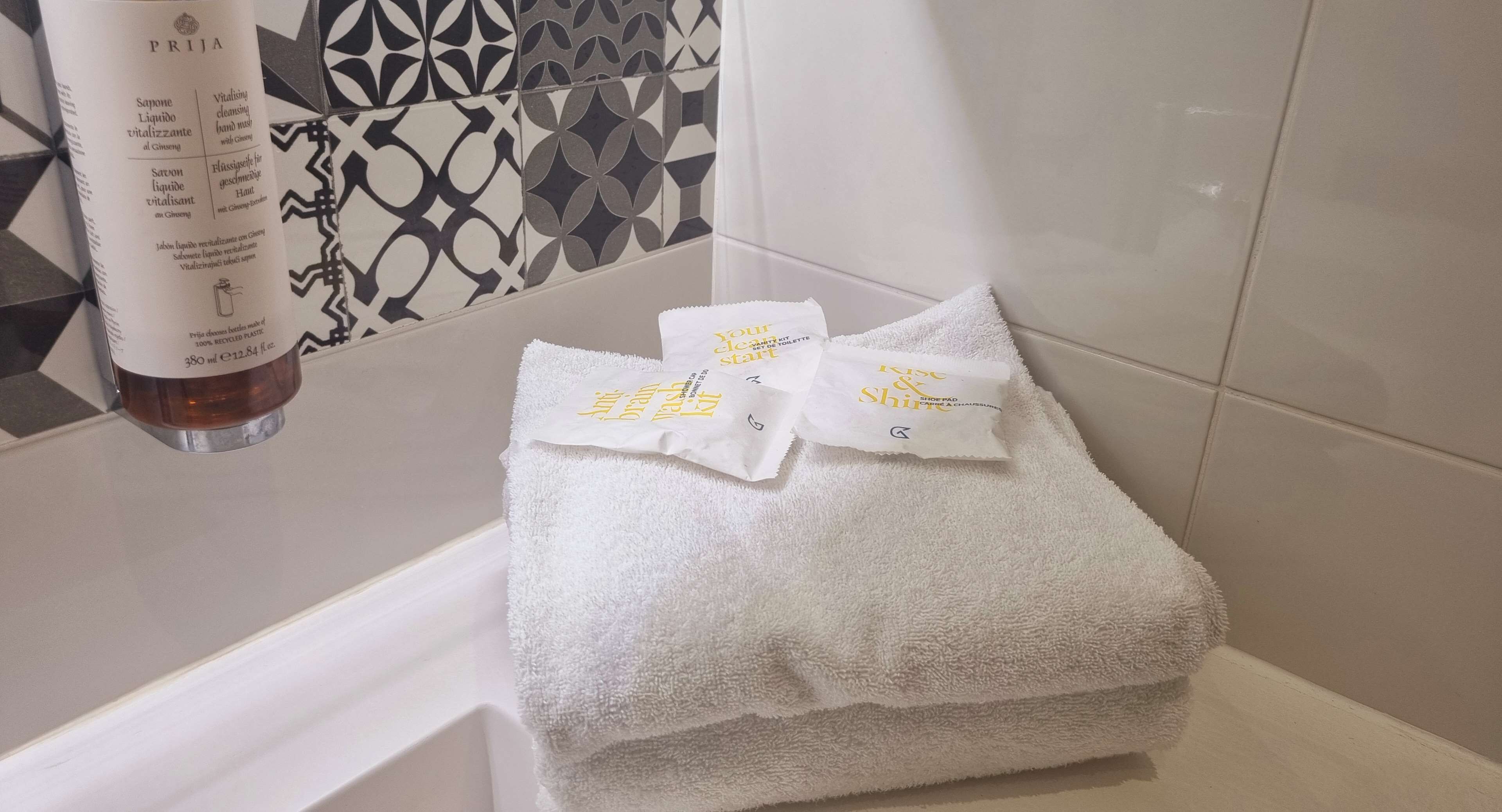 eco-friendly toiletries, hair dryer, towels