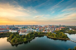 An aerial view of a city with a river, buildings, and a bridge. - Radisson Blu Scandinavia Hotel, Copenhagen, A Verified Net Zero Hotel (Copenhagen)