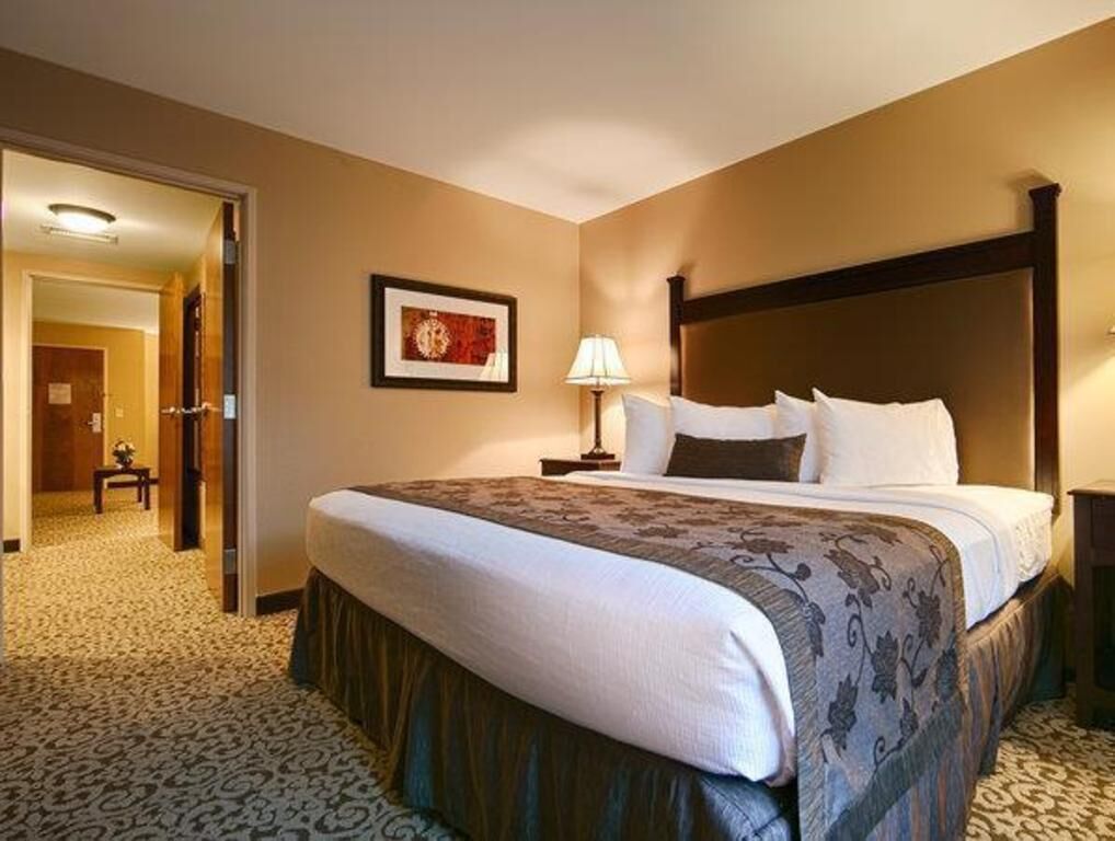 Premium bedding, desk, laptop workspace, blackout drapes