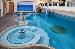 Indoor pool, open 8:00 AM to 8:00 PM, pool loungers