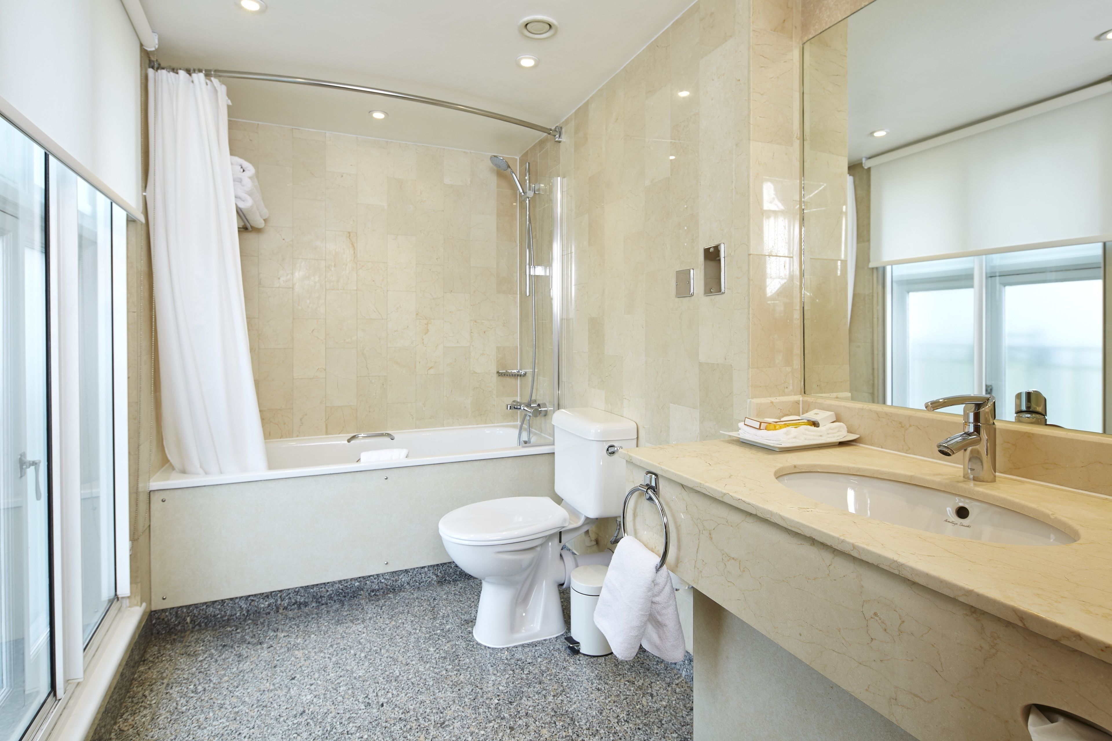 separate bathtub and shower, designer toiletries, hair dryer, towels