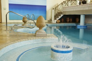 Indoor pool, open 8:00 AM to 8:00 PM, pool loungers