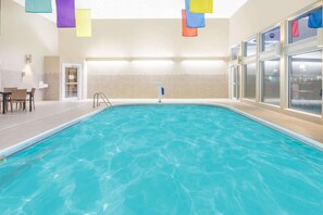 Indoor pool, open 9:00 AM to 10:00 PM, pool loungers