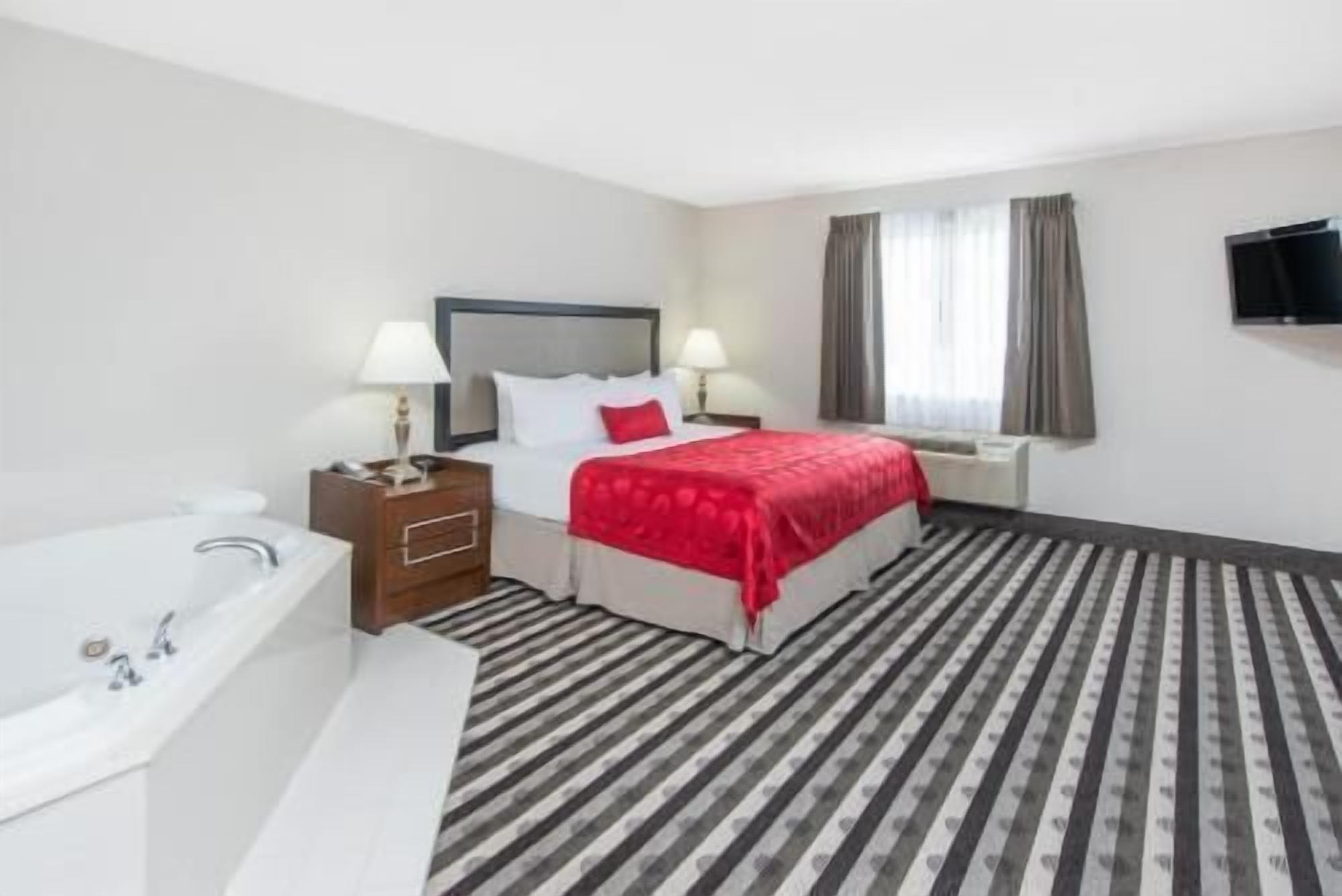 Premium bedding, desk, blackout drapes, iron/ironing board
