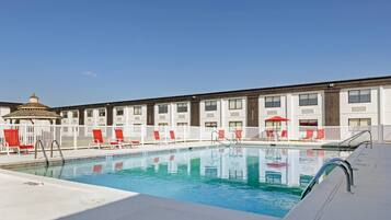 Seasonal outdoor pool, open 9:00 AM to 9:00 PM, pool loungers