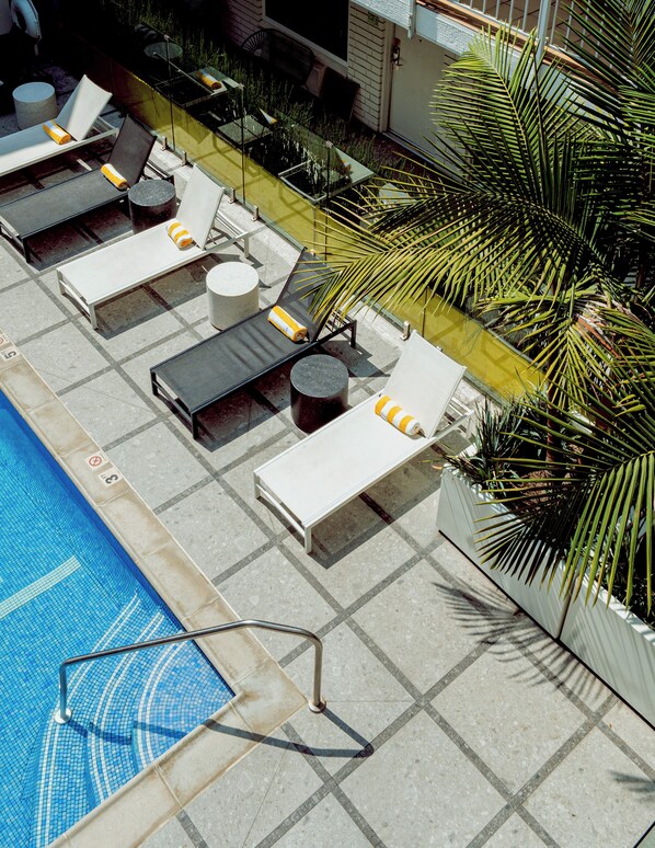 Outdoor pool, open 9:00 AM to 10:00 PM, sun loungers