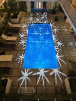 Outdoor pool, open 9:00 AM to 10:00 PM, pool loungers