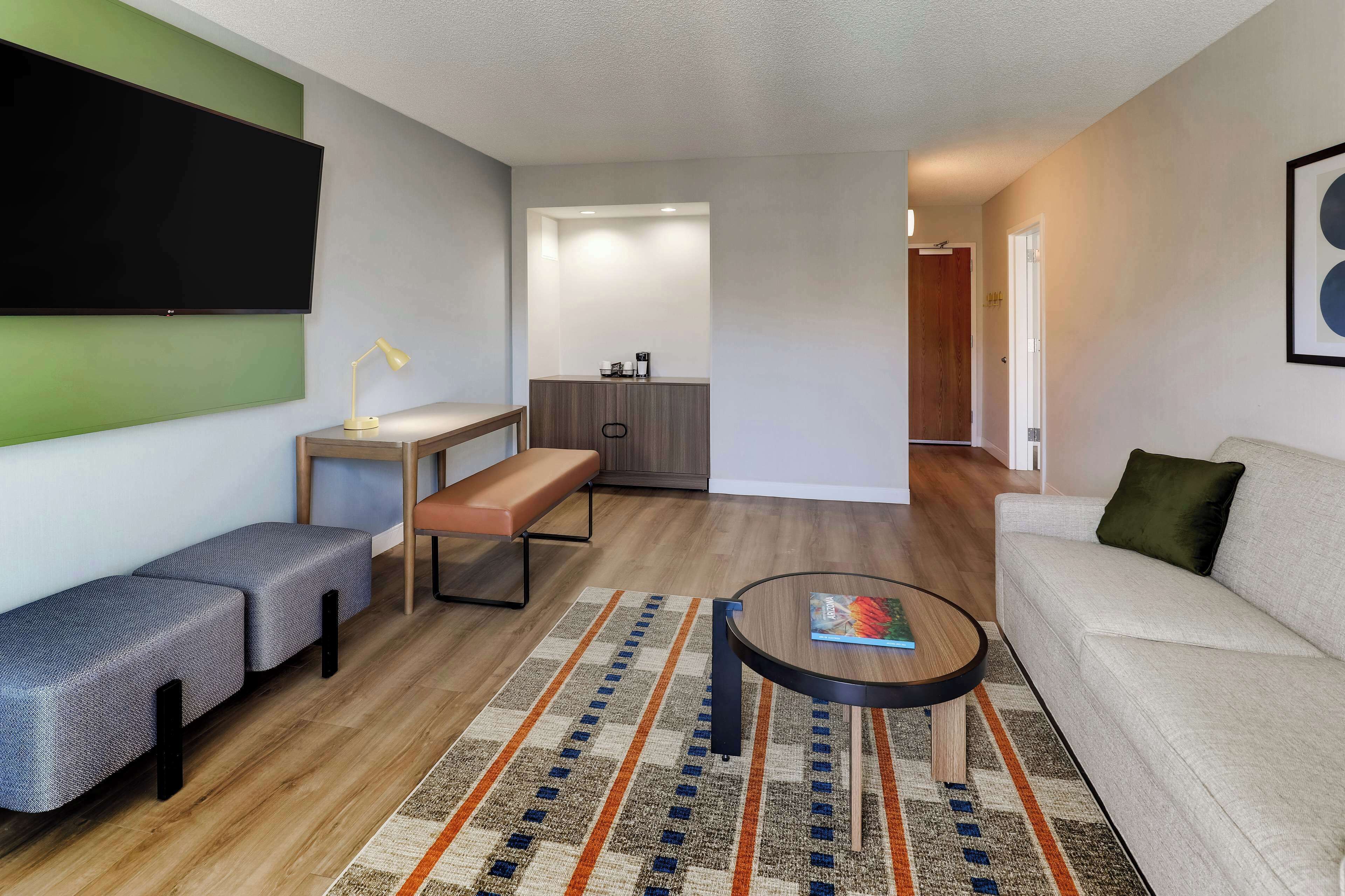 superior suite, multiple beds (one bedroom) | living area | 55-inch tv with cable channels